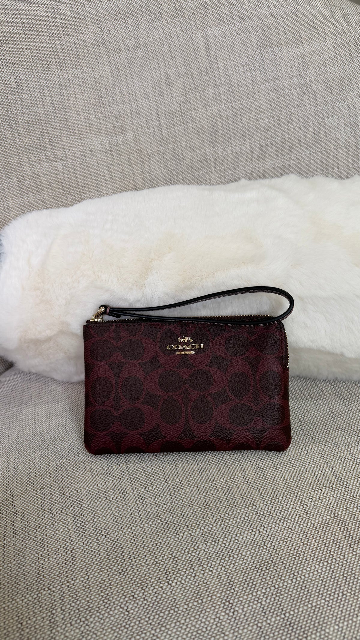 Muñequera Coach tinta estampada chica un cierre