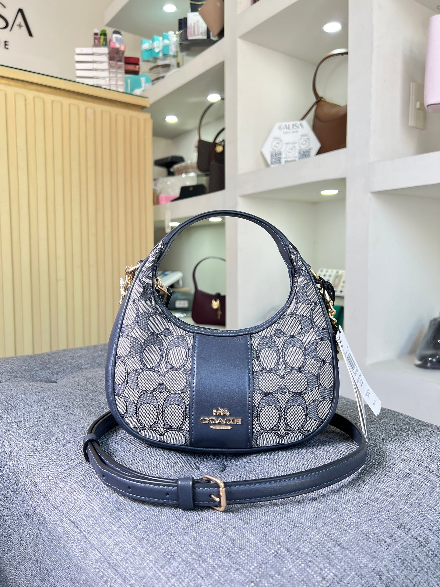 Bolsa Coach azul marino chica