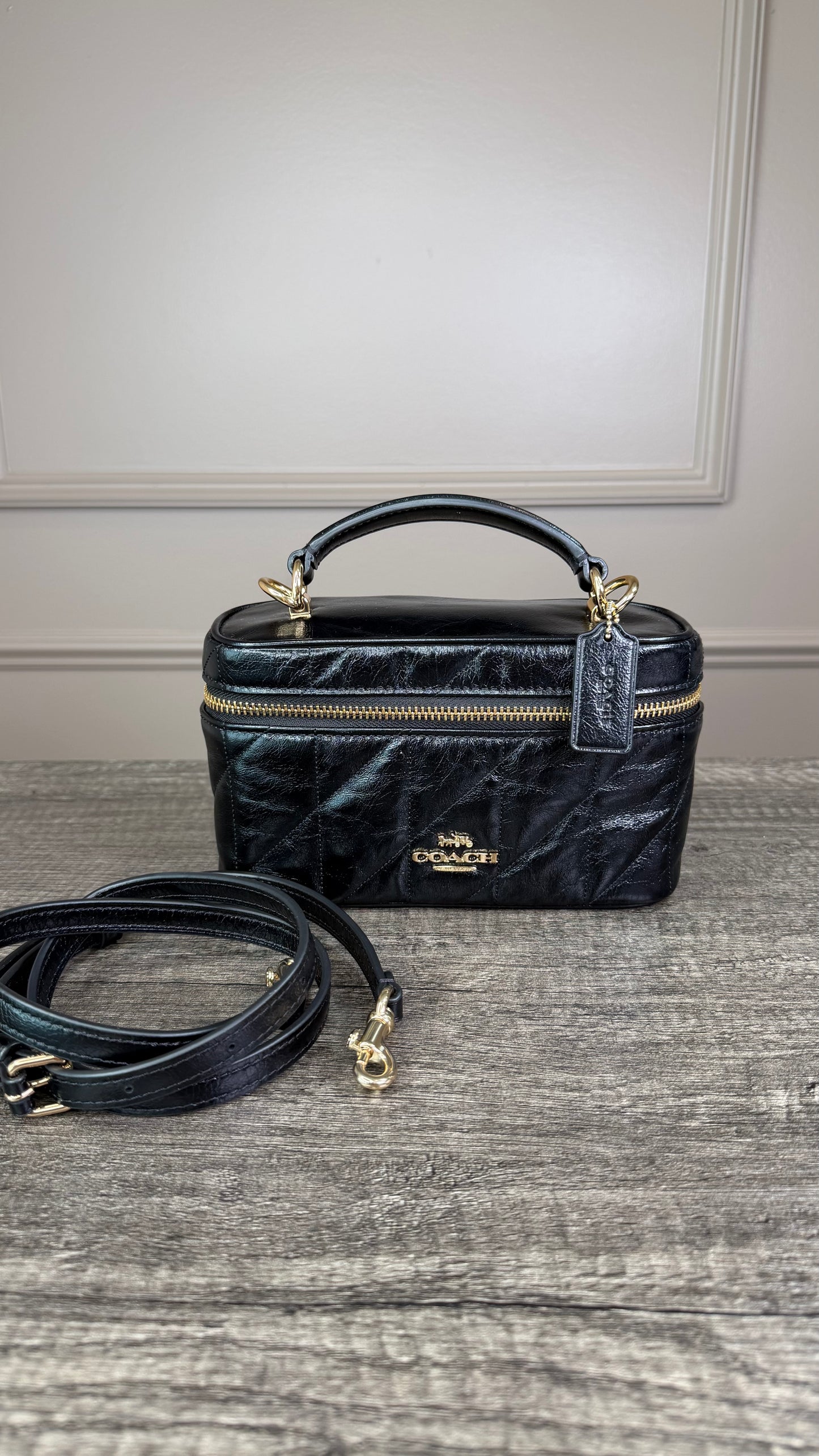 Bolsa Coach negra baul lisa