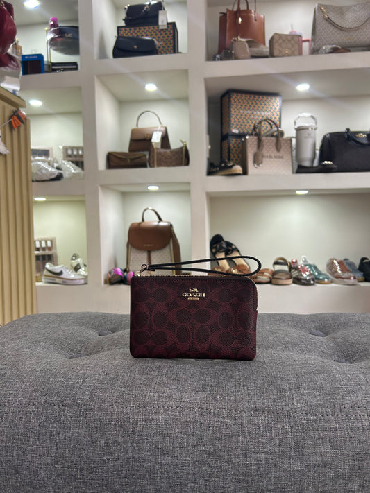 Muñequera Coach tinta estampada chica un cierre