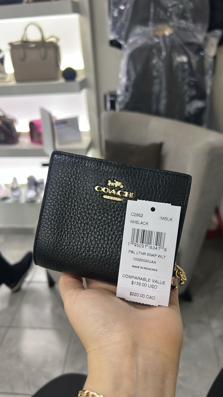 Cartera Coach negra lisa