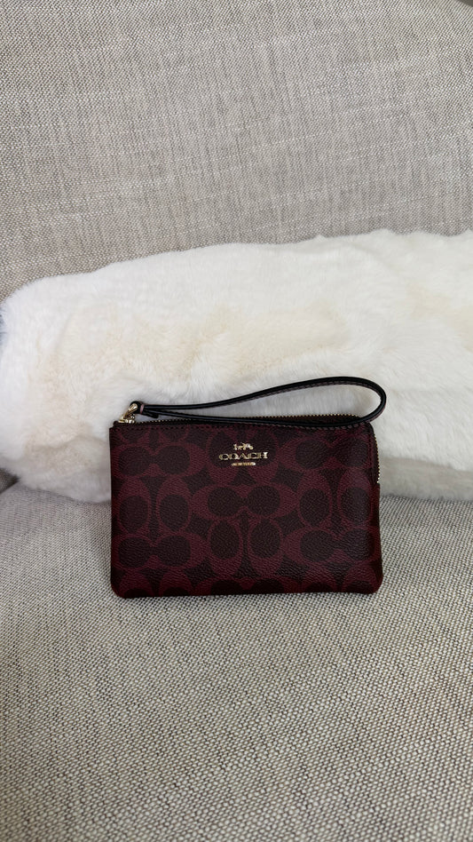 Muñequera Coach tinta estampada chica un cierre