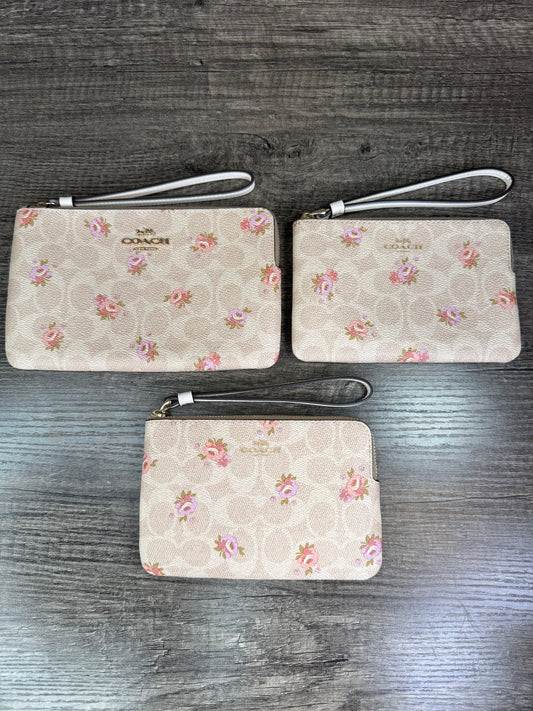 Muñequera Coach flores beige/blanco