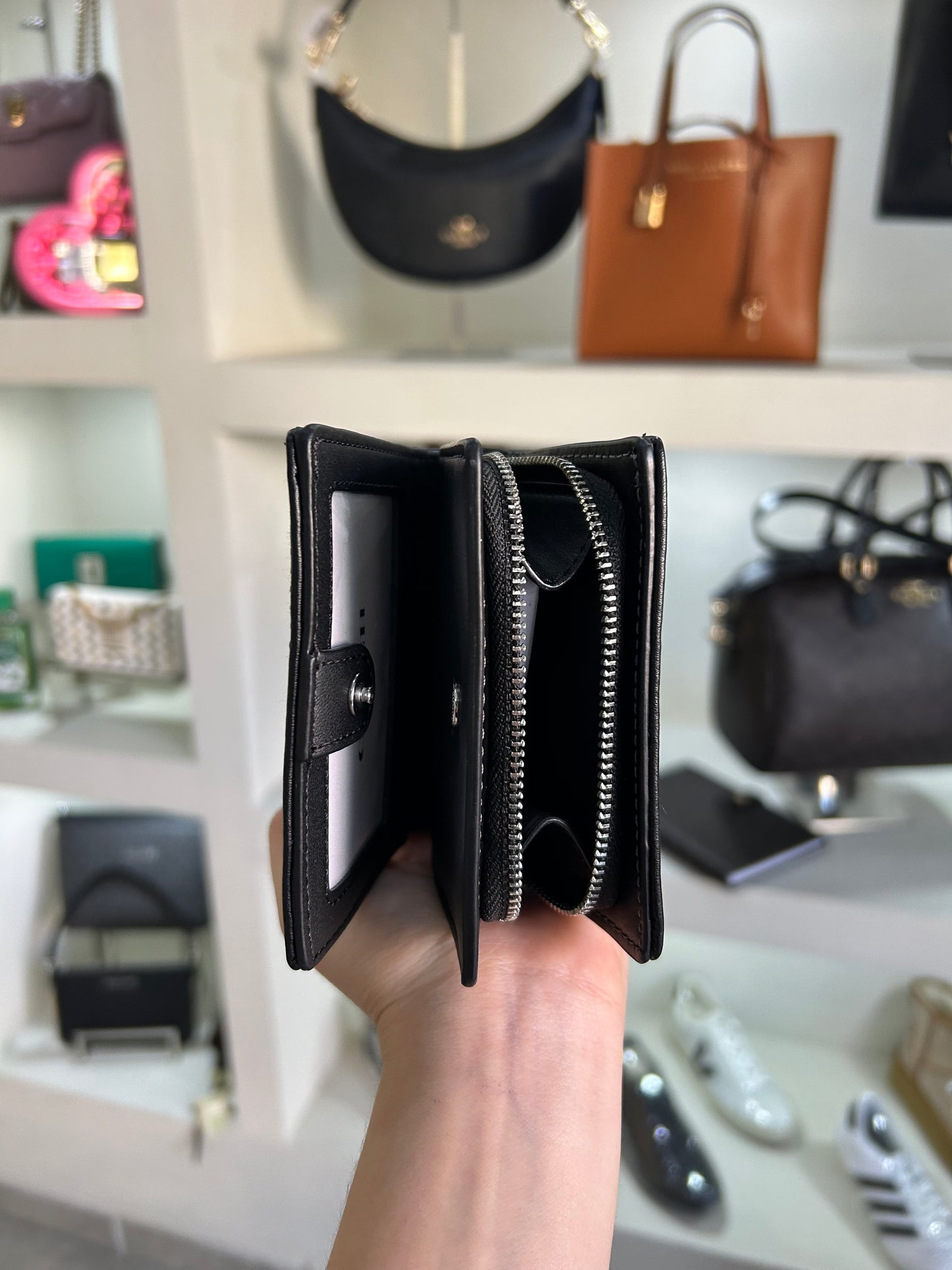 Cartera Coach negra estampada cierre alrededor