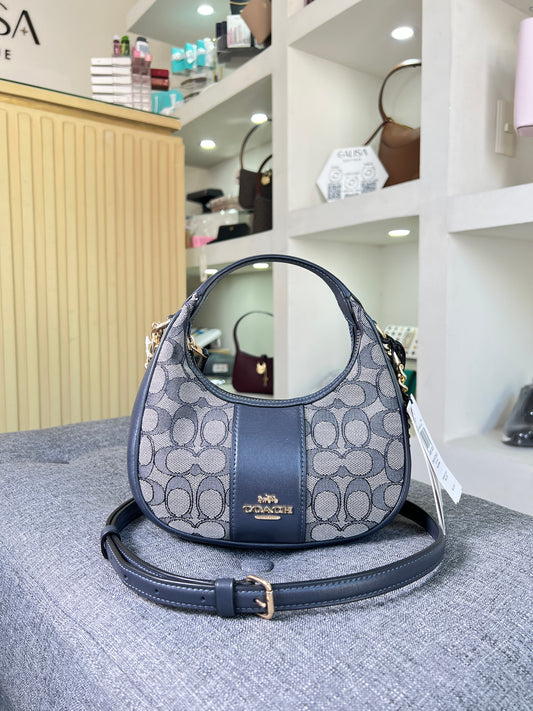 Bolsa Coach azul marino chica