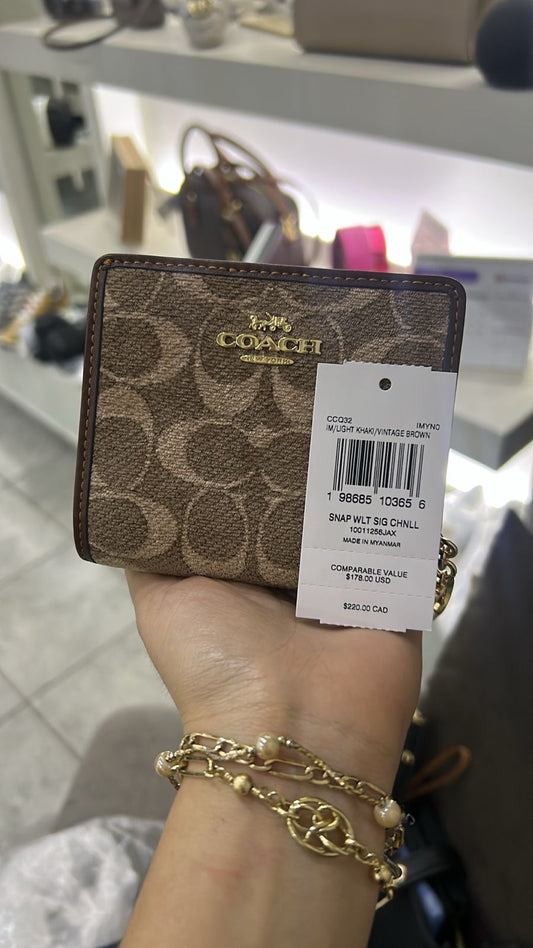 Cartera Coach cafe estampada
